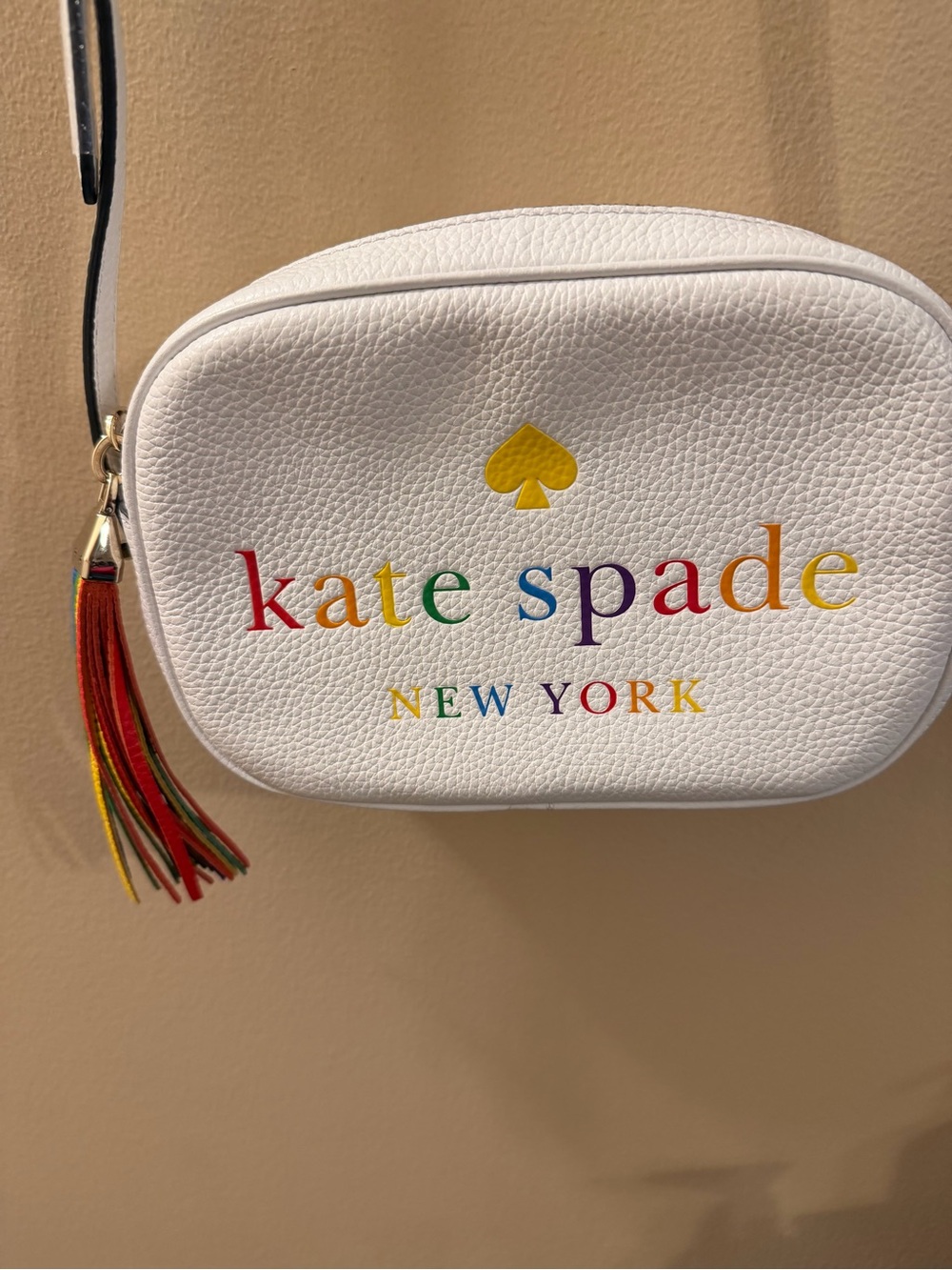 kate spade White Rainbow Logo Crossbody with Tassel Accent